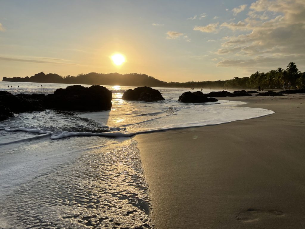 You belong here, sunset reflection on the sea of Samara Beach, Costa Rica